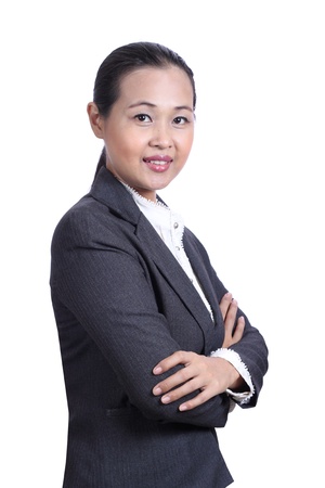 Portrait of a smiling young businesswoman with arms crossedの写真素材