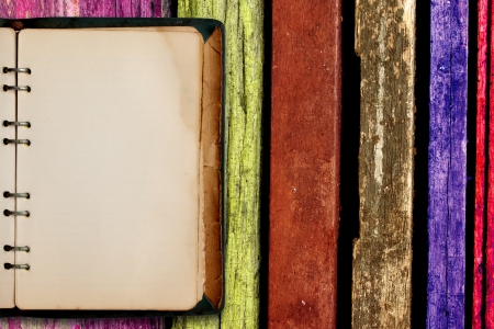 old book  with multicolored wooden backgroundの写真素材
