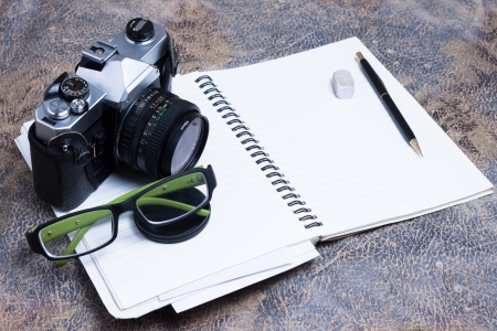 Group of objects on leather. Camera, diary and pen to note all the memories, ideas and plans. Studio shot.の写真素材