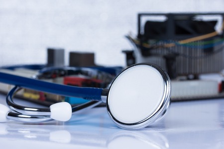 Stethoscope and printed computer motherboardの写真素材