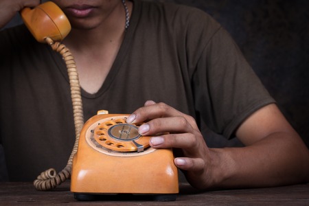 A man holding up the phoneの写真素材