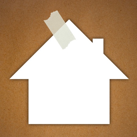 Sticky Note on wood background, House shapeの写真素材