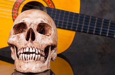 Head skull with  classical guitarの写真素材
