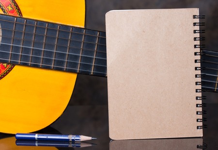 Diary ring binder with classical guitar backgroundの写真素材