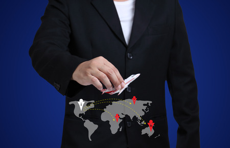 Businessmen with airplane and world mapの写真素材