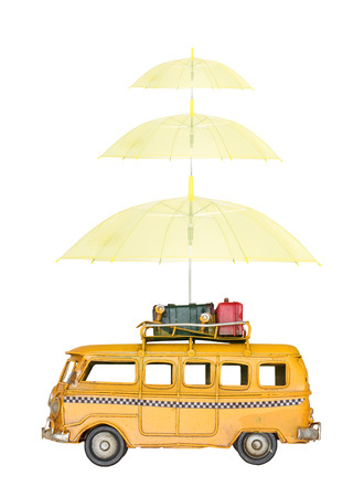Miniature car with umbrella, isolated on white backgroundの写真素材