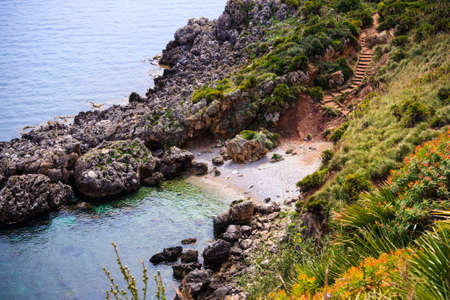 Stairway sloping down to the sea in Zingaro Natural Reserve, Sicily, Italyの写真素材