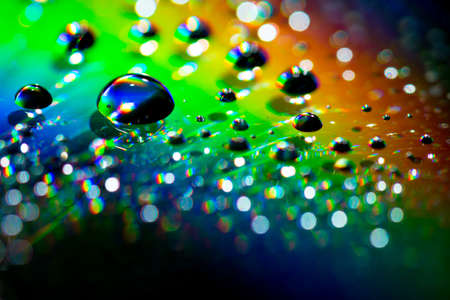 Water drops on the surface of a CD. Abstract Effect, Rainbow Colorsの写真素材