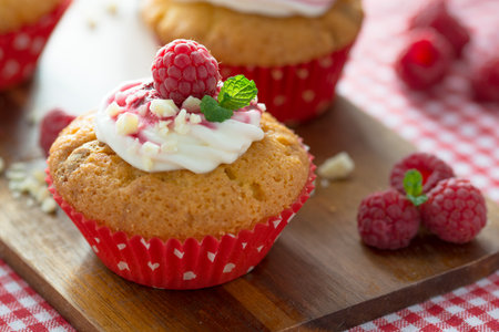 Sweet Temptation: Raspberry Cupcakes with White Chocolate Frosting - Homemade Delight for Refined Palatesの写真素材