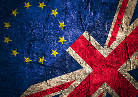 Image relative to politic relationships between Europe Union and United Kingdom. National flags on concrete textured backdrop. Brexit themeの写真素材