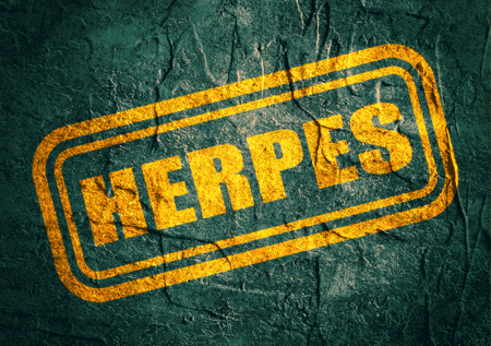 Stamp with herpes text over concrete textured background. Medical science relative themeの写真素材