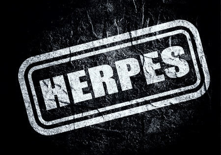 Stamp with herpes text over concrete textured background. Medical science relative themeの写真素材