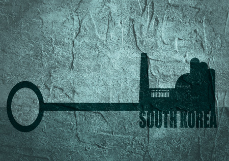 Flat design style modern illustration concept of hand holding a key of south korea industry. Factory icon and text on key. Concrete texturedの写真素材