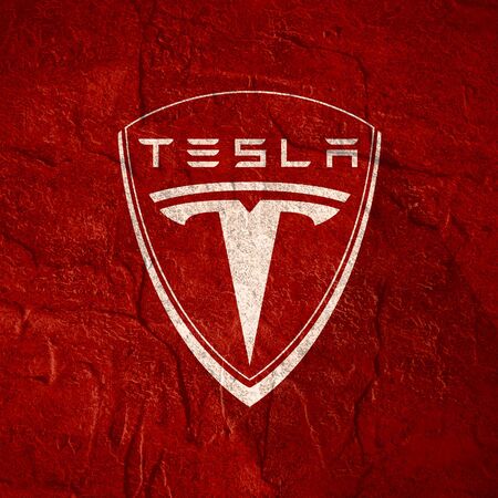 Circa - February 5, 2018: Tesla company emblem. Tesla is a American automobile manufacturer. Long shadows designのeditorial素材