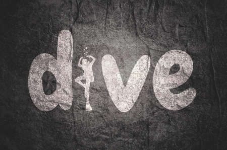 Dive word with silhouette of diver. The concept of sport diving.の写真素材