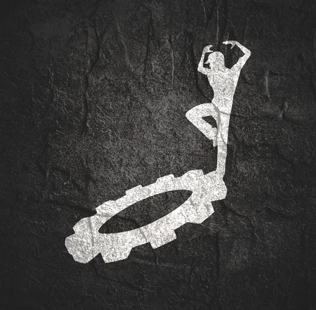 Young man silhouette. Worker model dancing on the gearの写真素材