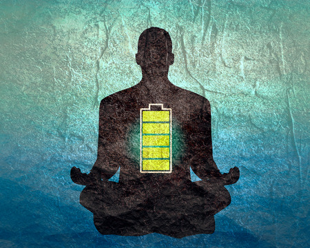 Businessman in with battery icon. Full battery concept. Business and life energy. High full level energy battery. Man sit in meditation pose.の写真素材