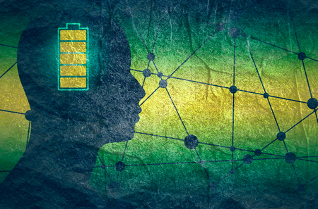 Silhouette of a mans head with high full level energy battery icon.の写真素材