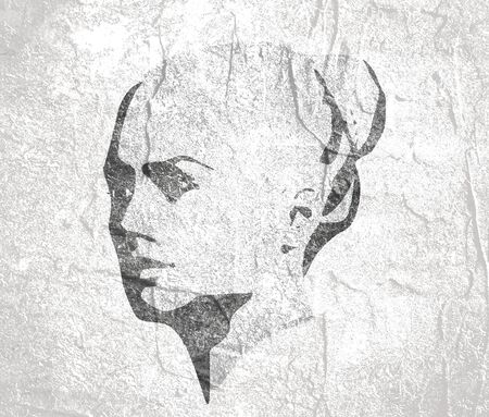 Face side view. Elegant silhouette of a female head. Bun hair style.の写真素材