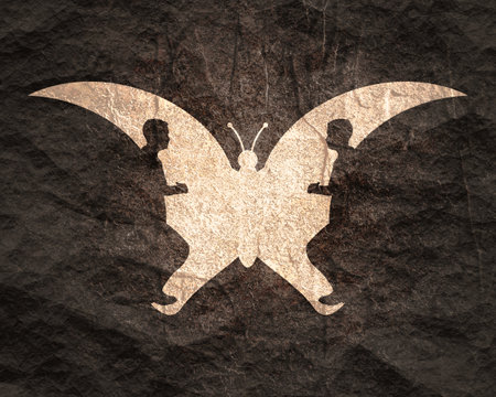 A butterfly or two man profile view. Optical illusion. Human make silhouette of insectの写真素材