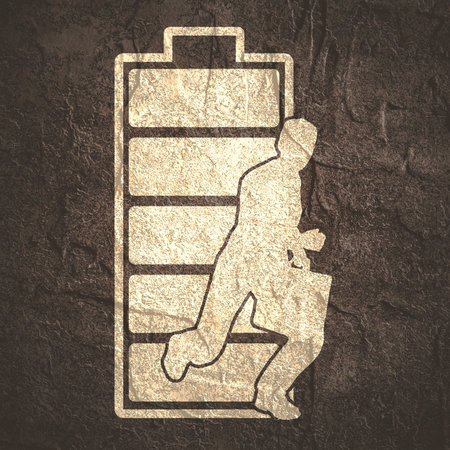 Businessman running with briefcase and battery iconの写真素材