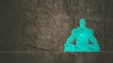 Bodybuilder relaxing in yoga pose. Cutout silhouette.の写真素材