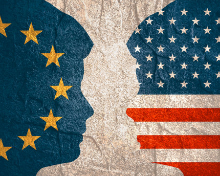 Image relative to politic and economic relationship between USA and European Union. National flags inside the heads of the businessmen. Teamwork concept.の写真素材