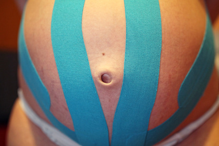kinesiology plaster on the bellyの写真素材