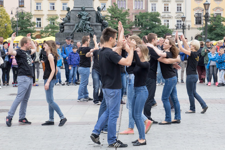 POLAND, KRAKOW 02,09,2017 young boys and girls dancing in the squareのeditorial素材