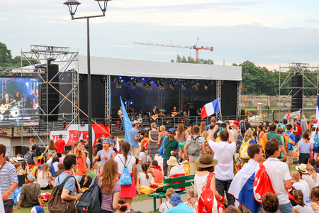 KRAKOW, POLAND -  2016 - World Youth Day 2016, A crowd of people listen to the concert on the banks of the Vistulaのeditorial素材