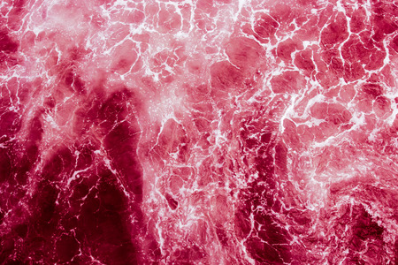 Bright red with white veins abstract background, looks like the atmosphere of a space planet or galaxyの写真素材