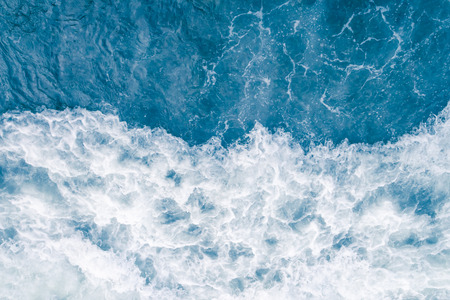 Pale blue sea wave during high summer tide, abstract ocean backgroundの写真素材