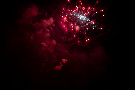 fireworks in the night sky with smoke and firework background.の写真素材