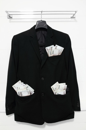 banknote in pocket black suitの写真素材