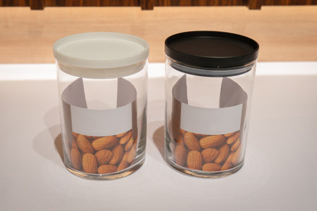 Black and White Glass Jars with Lids are a stylish and practical storage solution for any home. Made of high-quality glass, these jars come with tight-fitting lids that keep your food items fresh and protected from dust and insects.の写真素材