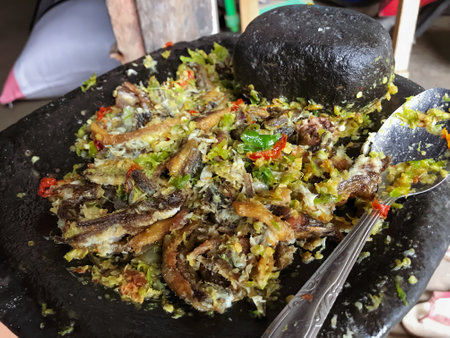 Fried Eel with Onion Chili Sauce is a delicious Indonesian dish that combines crispy fried eel with a spicy and savory onion chili sauce.の写真素材