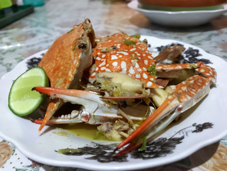 Green Chili Crab with a Hint of Lime Juice is a delicious seafood dish that combines fresh crab meat with a spicy green chili sauce and a tangy lime juice for added flavor.の写真素材