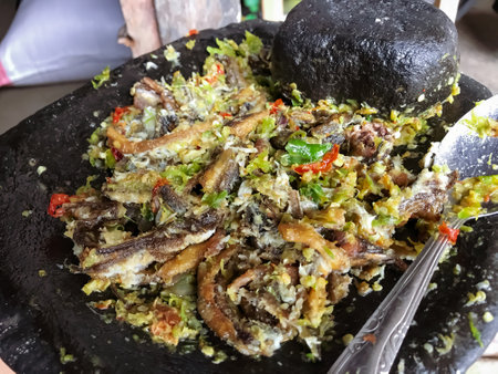 Fried Eel with Onion Chili Sauce is a delicious Indonesian dish that combines crispy fried eel with a spicy and savory onion chili sauce.の写真素材