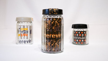 Black and Grey Plastic Sealed Twist Glass Jars are a sleek and stylish storage solution for any home. These jars feature a unique twist pattern on the glass body and come with black and grey plastic lids that seal tightly to keep contents fresh and secure.の写真素材