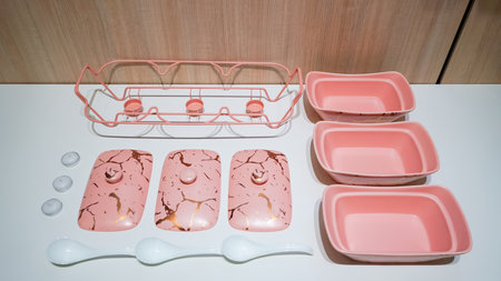 This pink ceramic vegetable bowl is a stunning addition to any kitchen.の写真素材