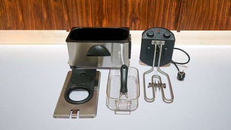 This deep fryer is made of durable stainless steel material that ensures its longevity and easy maintenance.の写真素材