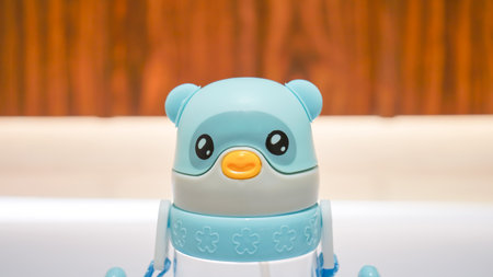 This water bottle is specially designed for school kids with a cute light blue color and animal prints on the surface.の写真素材