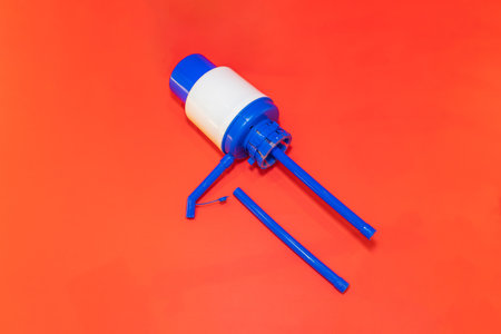 The Blue Water Jug Pump is a convenient and efficient water dispenser designed to fit on top of standard water jugs.の写真素材