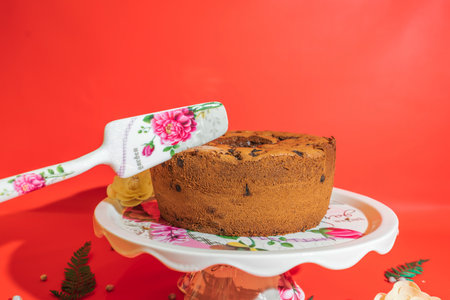 The White Ceramic Round Cake Stand with Flower Motif is a stunning centerpiece for your desserts.の写真素材