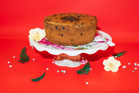The White Ceramic Round Cake Stand with Flower Motif is a stunning centerpiece for your desserts.の写真素材
