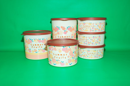 The Round Plastic Jar with Brown Lid and Fruit Illustration is a versatile and practical storage solution for your kitchen.の写真素材
