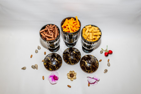 The Set of Three Black Ceramic Jars with Gold Motifs is a stunning addition to your home decor.