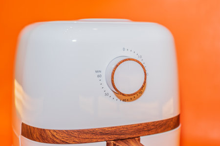 The White Air Fryer with Wooden Handle Design combines functionality and style in one appliance.