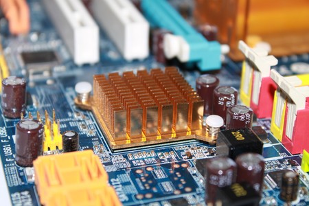 Computer motherboard surrounded by other components