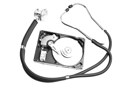 Computer hard drive and a stethoscope isolated on white